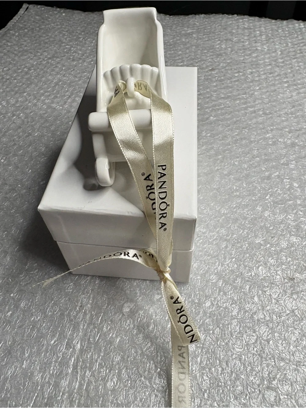 Pandora white porcelain sleigh ornament